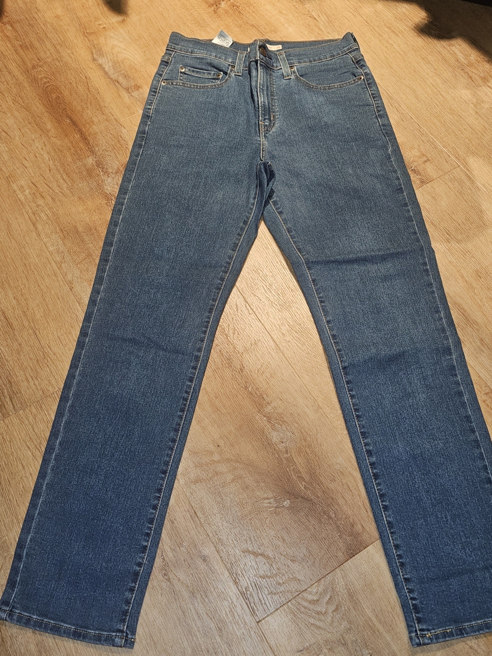 Levi's Women's 724 High Rise Straight Jeans in a medium blue wash 29x30